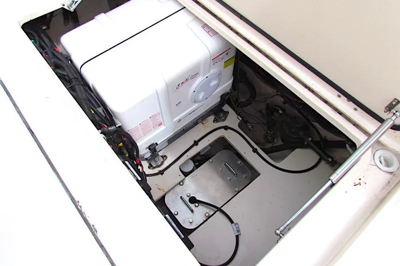 Slide: The Image of Engine compartment of a 2019 Grady-White Express 370 boat, showcasing machinery and wiring. - 14