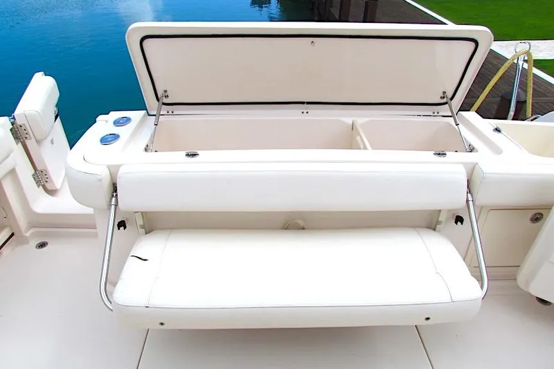 Slide: The Image of 2019 Grady-White Express 370 boat with open storage compartment and cushioned seating. - 21
