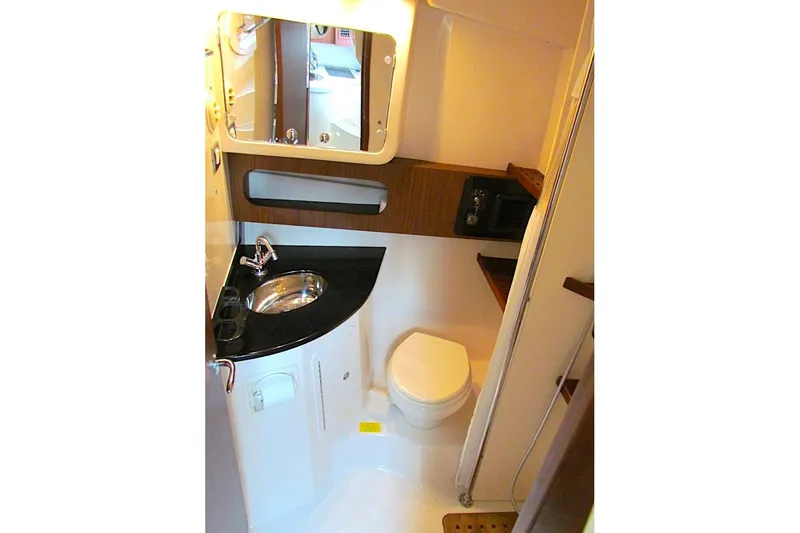 Slide: The Image of 2019 Grady-White Express 370 boat bathroom with sink, mirror, and toilet. - 29