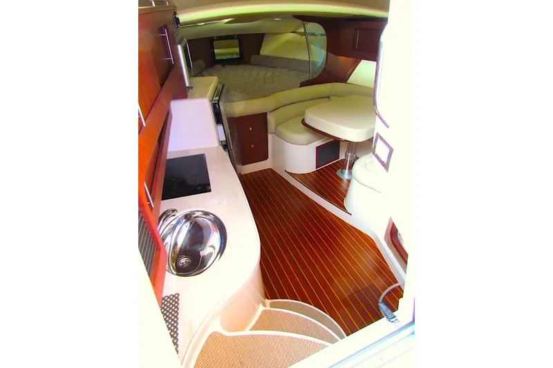 Slide: The Image of 2019 Grady-White Express 370 interior with wood flooring and modern amenities. - 30