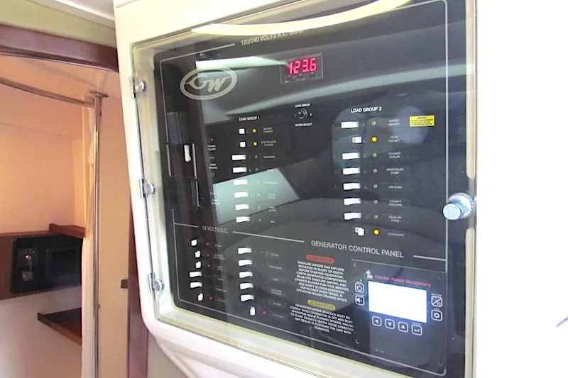 Slide: The Image of Generator control panel on 2019 Grady-White Express 370 boat interior. - 32