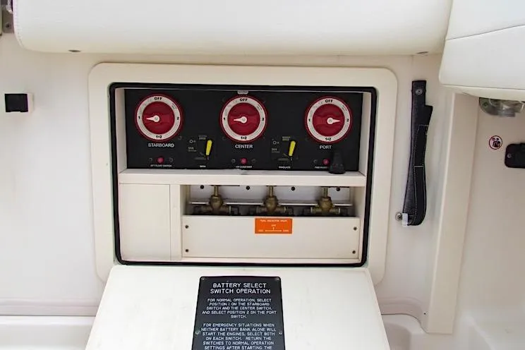 Slide: The Image of Control panel of a 2019 Grady-White Express 370 boat, featuring battery switches. - 35