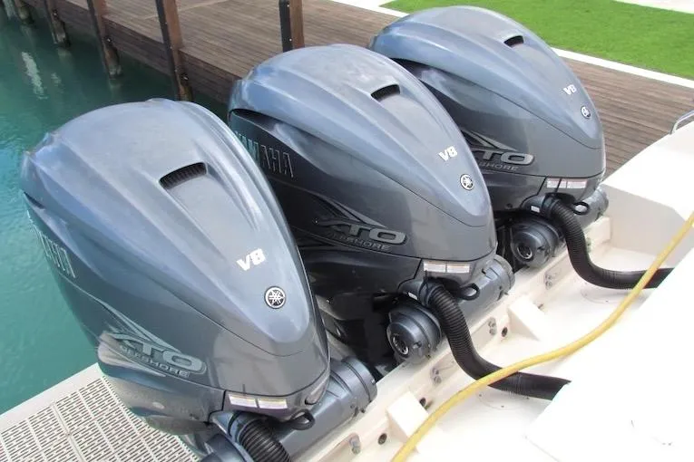 Slide: The Image of Triple Yamaha XTO V8 outboard engines on a 2019 Grady-White Express 370 boat. - 5