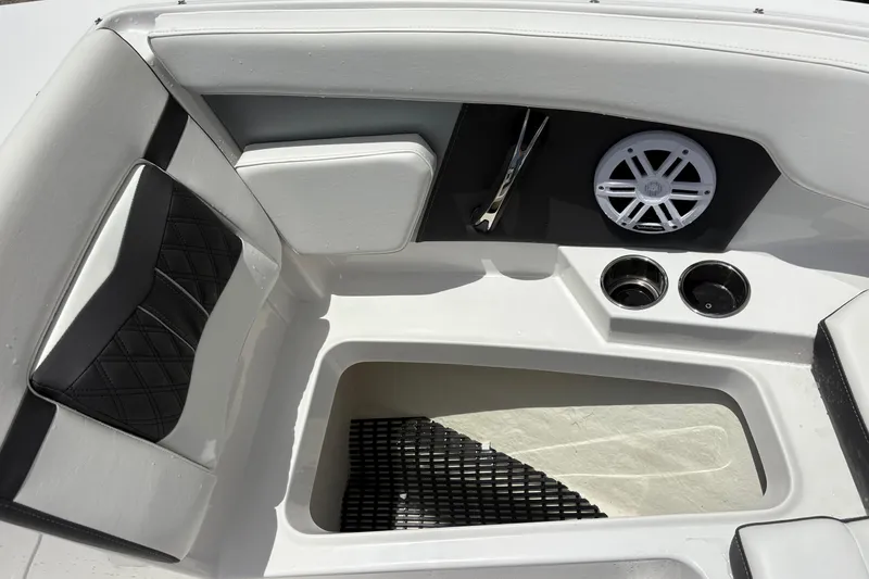 Slide: The Image of 2024 Monterey M-205 boat interior with seating, speaker, and cup holders. - 14