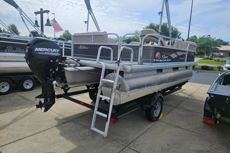 Slide: The Image of 2019 Sun Tracker Party Barge 18 DLX pontoon boat with Mercury engine on trailer. - 4
