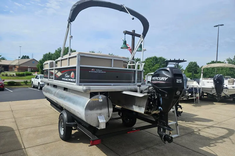 Slide: The Image of 2019 Sun Tracker Party Barge 18 DLX pontoon boat with Mercury 25 engine on trailer. - 5