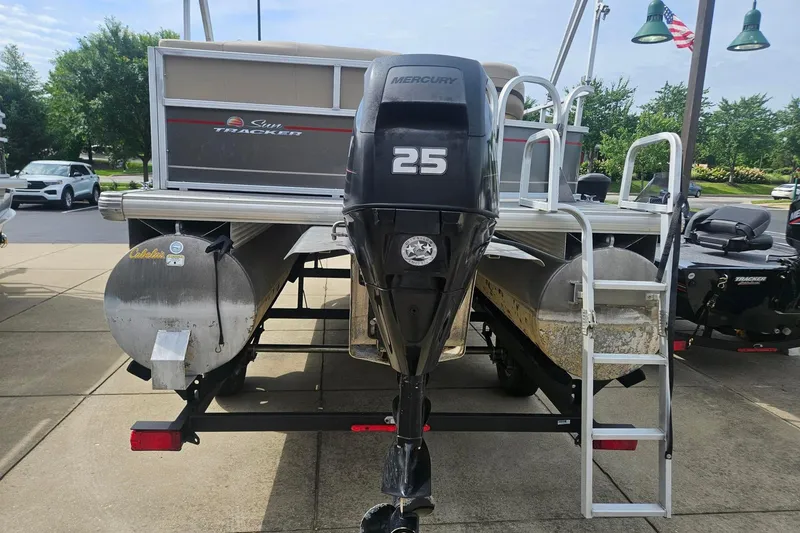 Slide: The Image of 2019 Sun Tracker Party Barge 18 DLX with Mercury 25 outboard motor, rear view. - 6