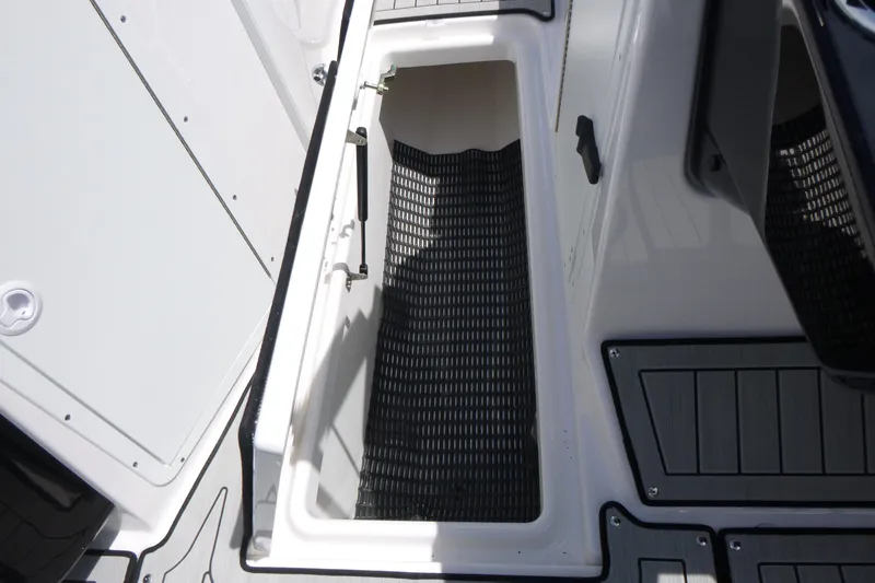 Slide: The Image of 2026 Yamaha Boats 222S storage compartment with non-slip flooring. - 10