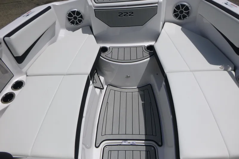 Slide: The Image of 2026 Yamaha Boats 222S interior with white seating and sleek design. - 7