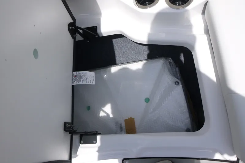 Slide: The Image of Storage compartment in 2026 Yamaha Boats 222S, featuring a hinged lid and interior space. - 8