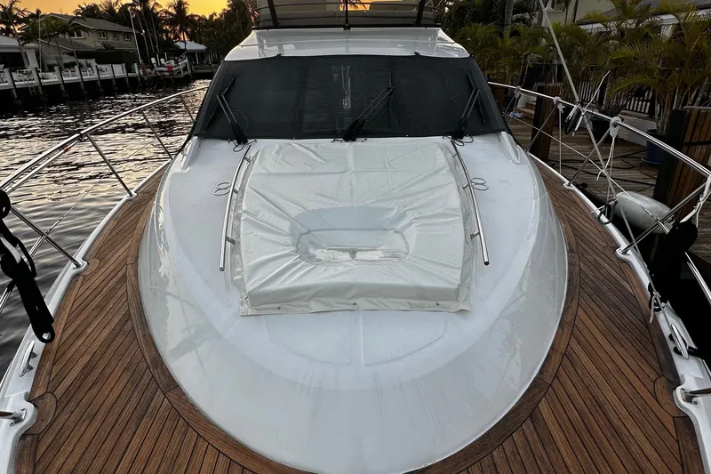 Slide: The Image of 2015 Sea Ray 510 Fly yacht docked at sunset. - 23