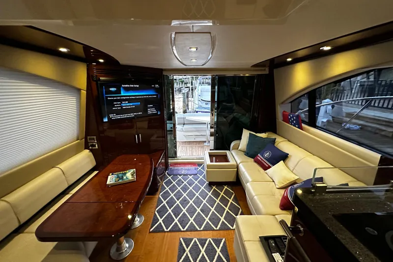 Slide: The Image of Interior of a 2015 Sea Ray 510 Fly yacht with luxurious living area. - 27
