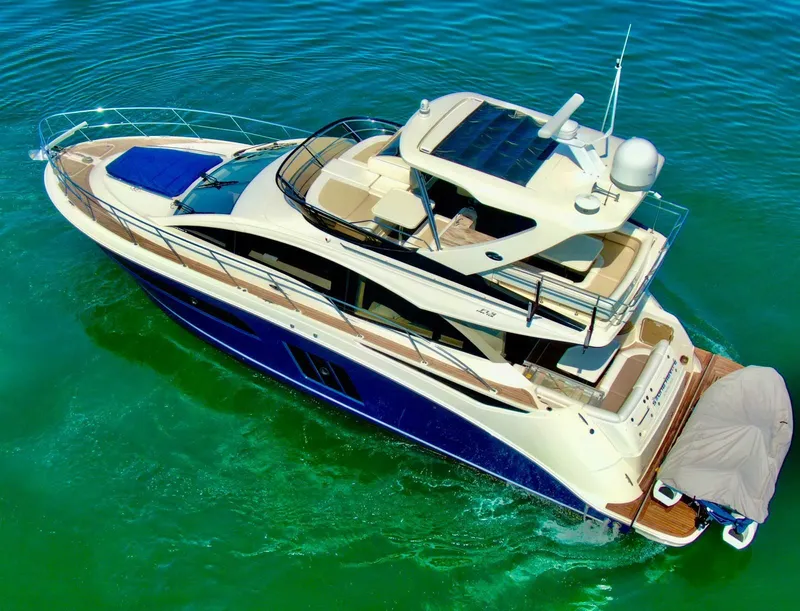 Slide: The Image of 2015 Sea Ray 510 Fly yacht on calm waters. - 5