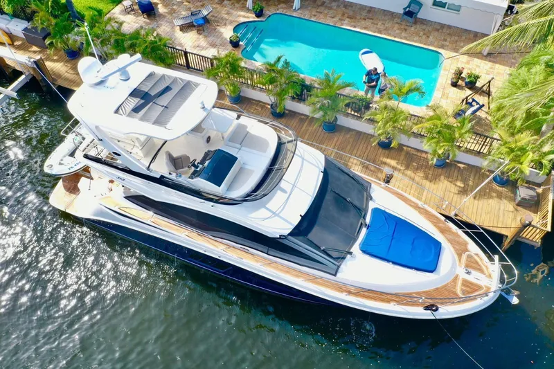 Slide: The Image of Aerial view of a 2015 Sea Ray 510 Fly yacht docked. - 7