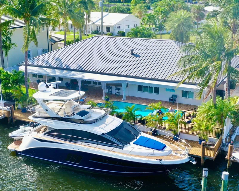 Slide: The Image of Luxury Sea Ray 510 Fly 2015 yacht docked by tropical house with pool. - 9