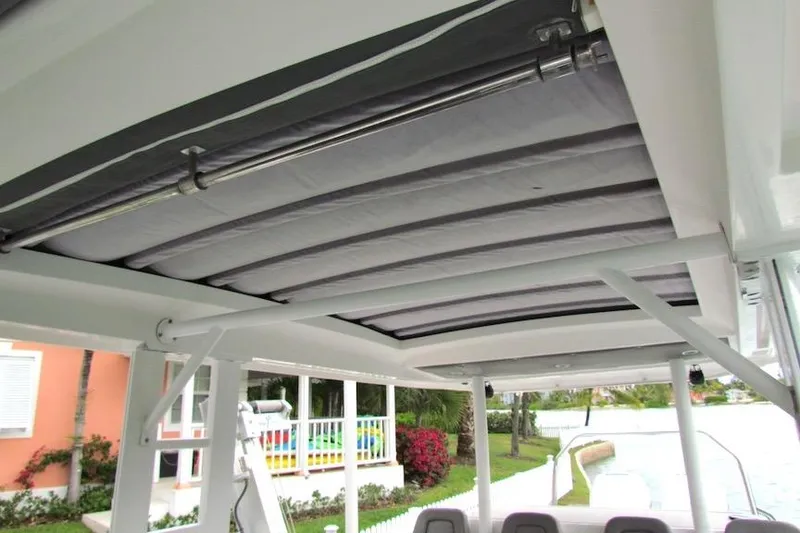 Slide: The Image of 2018 Axopar 37 Sun-Top boat canopy, showcasing retractable roof design. - 21