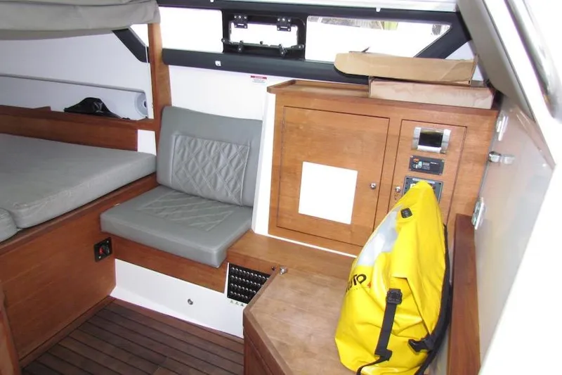 Slide: The Image of Interior of 2018 Axopar 37 Sun-Top boat with seating and storage. - 28
