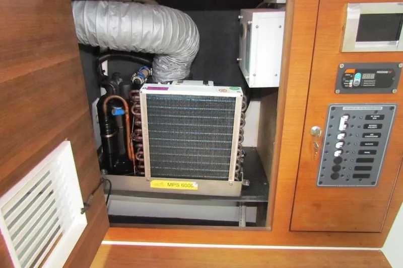 Slide: The Image of 2018 Axopar 37 Sun-Top boat interior showing electrical panel and ventilation system. - 29