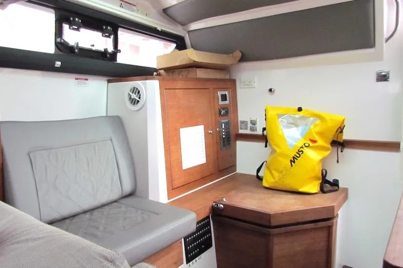 Slide: The Image of Interior of 2018 Axopar 37 Sun-Top boat with seating and storage area. - 31