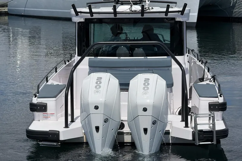 Slide: The Image of 2022 Axopar Brabus 28 Cabin with dual outboard engines on water. - 11