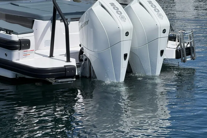 Slide: The Image of 2022 Axopar Brabus 28 Cabin with dual Mercury outboard engines on water. - 30
