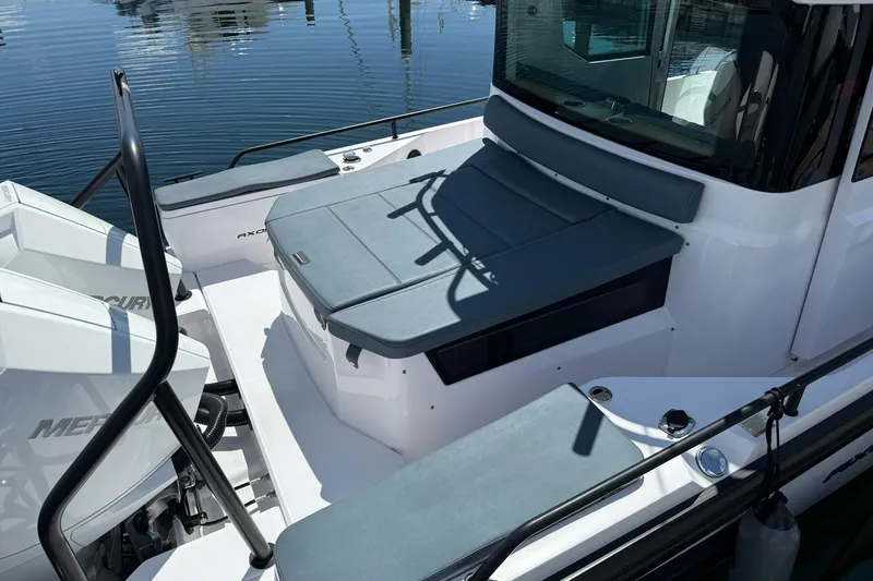 Slide: The Image of 2022 Axopar Brabus 28 Cabin boat with sleek seating and dual Mercury engines. - 34