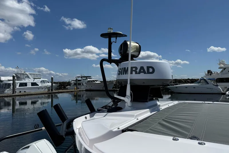 Slide: The Image of 2022 Axopar Brabus 28 Cabin with Simrad equipment docked at marina. - 36