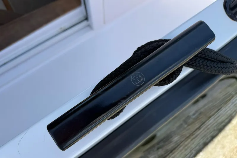 Slide: The Image of Black cleat with rope on 2022 Axopar Brabus 28 Cabin boat. - 41