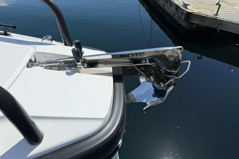 Slide: The Image of Anchor detail on 2022 Axopar Brabus 28 Cabin boat, docked in calm waters. - 47