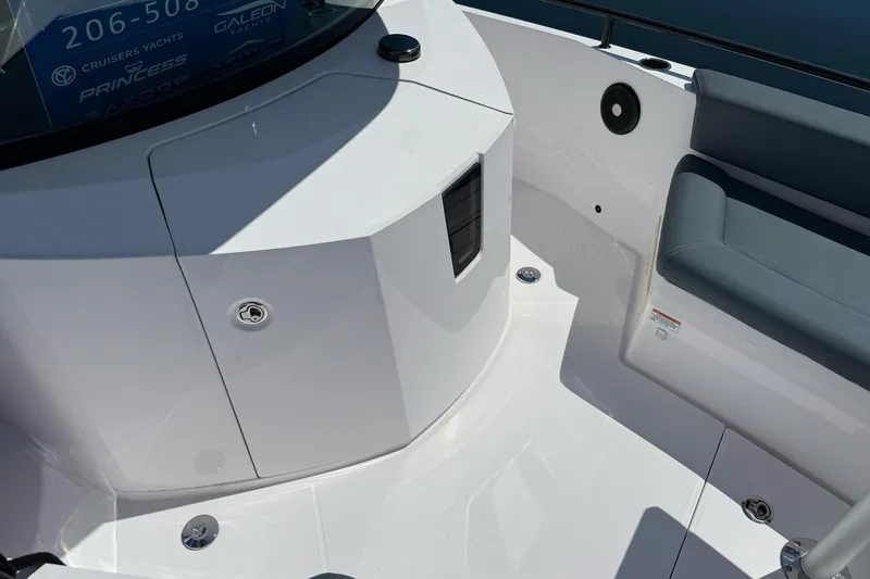 Slide: The Image of 2022 Axopar Brabus 28 Cabin interior with sleek white design and comfortable seating. - 48
