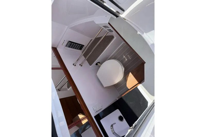 Slide: The Image of Interior of 2022 Axopar Brabus 28 Cabin, featuring compact bathroom amenities. - 49