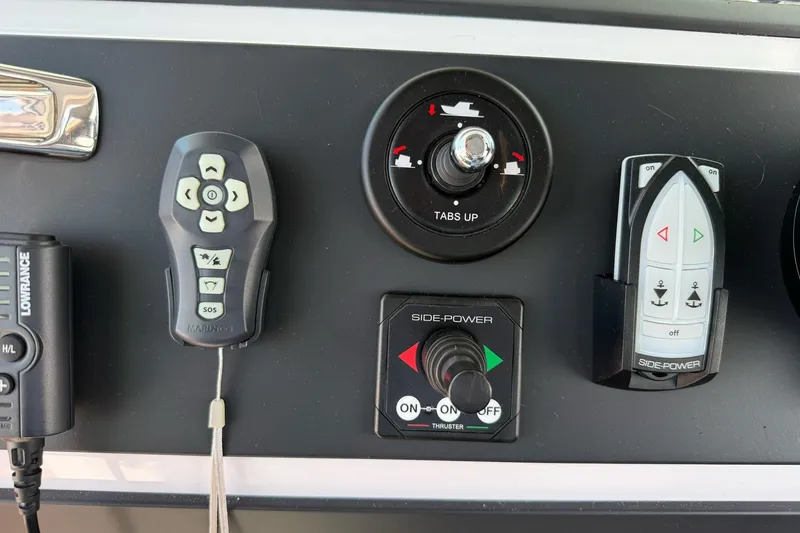 Slide: The Image of Control panel of 2022 Axopar Brabus 28 Cabin with various navigation controls. - 55