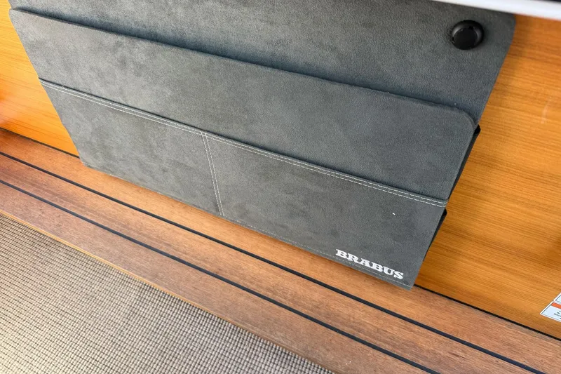 Slide: The Image of Gray Brabus storage pocket on 2022 Axopar Brabus 28 Cabin boat interior. - 57