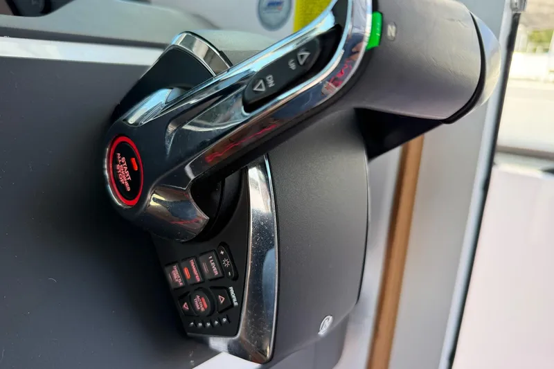 Slide: The Image of Throttle control of 2022 Axopar Brabus 28 Cabin boat, featuring start/stop button. - 58