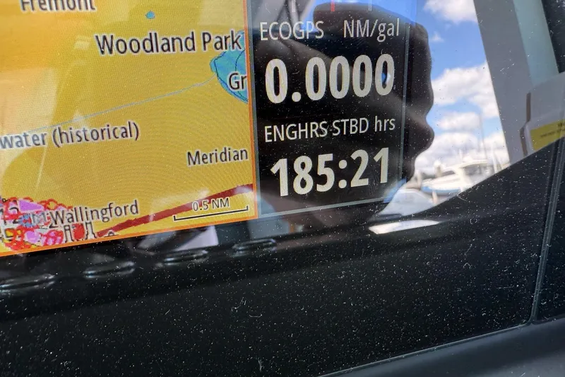Slide: The Image of Display screen on 2022 Axopar Brabus 28 Cabin showing navigation and engine hours. - 60