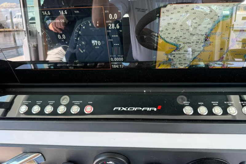 Slide: The Image of Dashboard of 2022 Axopar Brabus 28 Cabin with navigation and control panel. - 62