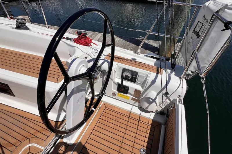 Slide: The Image of Cockpit of 2019 Dehler 34 sailboat with wooden deck and steering wheel. - 15