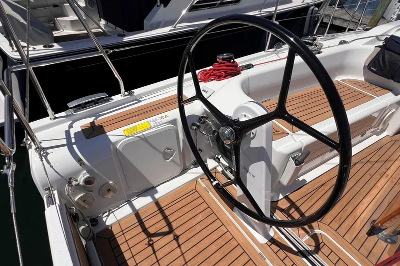 Slide: The Image of Cockpit of 2019 Dehler 34 sailboat with wooden deck and steering wheel. - 17