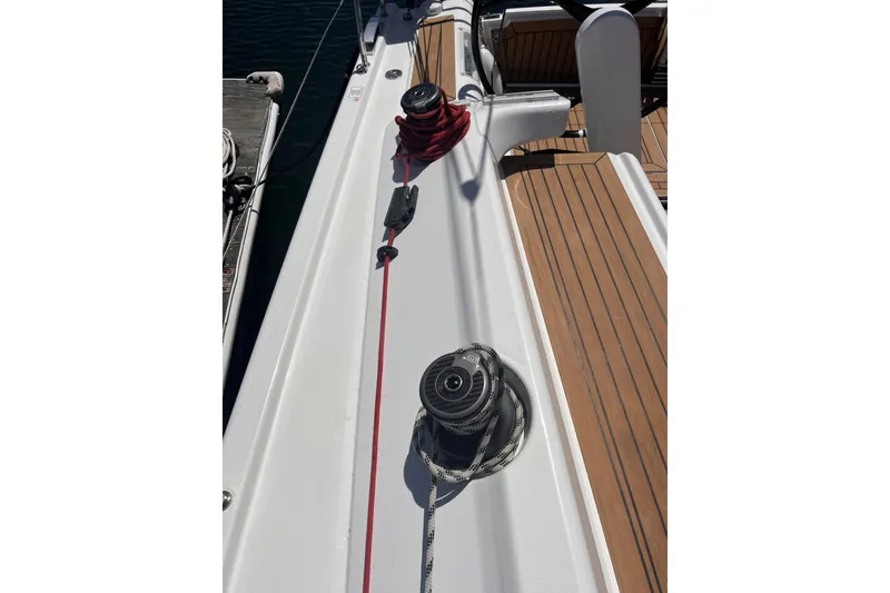 Slide: The Image of 2019 Dehler 34 sailboat deck with winches and teak flooring. - 20