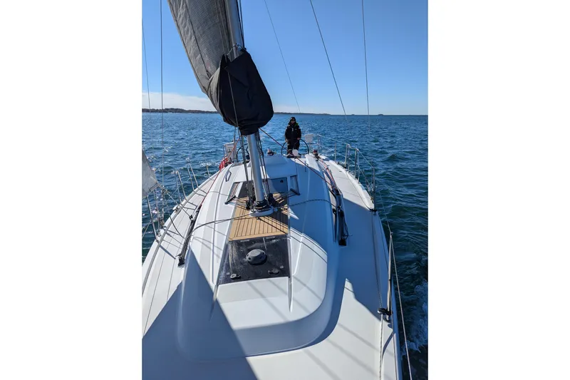 Slide: The Image of 2019 Dehler 34c sailboat navigating open waters under clear blue skies. - 30