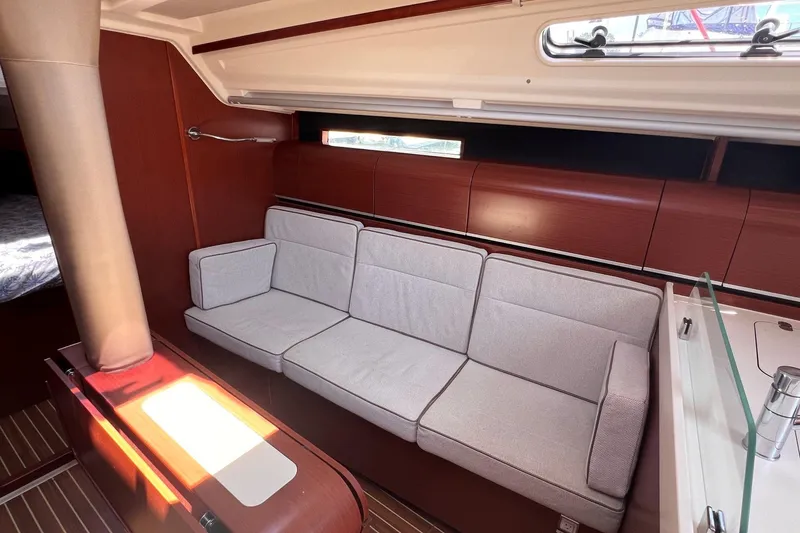 Slide: The Image of Interior of 2019 Dehler 34 yacht with elegant seating and wooden finishes. - 35
