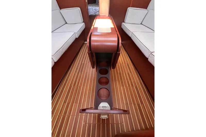 Slide: The Image of Interior of 2019 Dehler 34 yacht with wooden flooring and cushioned seating. - 39