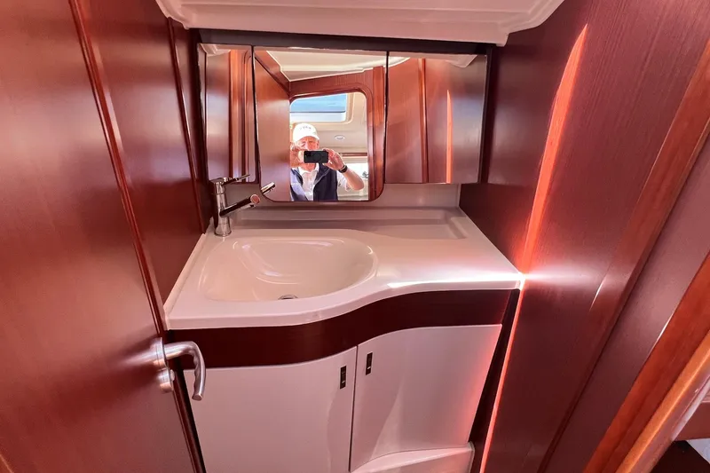 Slide: The Image of Interior of 2019 Dehler 34 yacht bathroom with sink and mirror. - 47