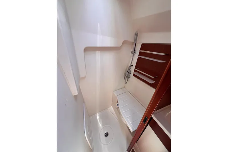 Slide: The Image of 2019 Dehler 34 yacht bathroom with shower and wooden shelving. - 48