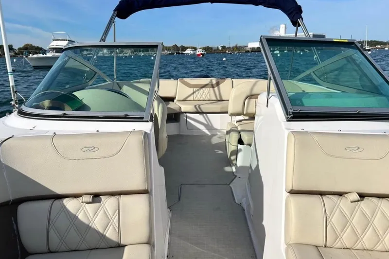Slide: The Image of 2020 Regal 23 OBX boat interior with beige seating on a sunny day. - 7