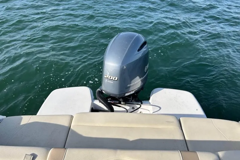Slide: The Image of 2020 Regal 23 OBX boat with Yamaha 200 outboard motor on water. - 8