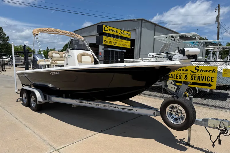 Slide: The Image of 2019 Key West 230 Bay Reef boat on trailer at sales and service center. - 1