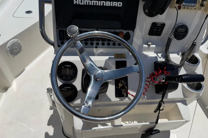 Slide: The Image of Steering console of 2019 Key West 230 Bay Reef boat with navigation equipment. - 12