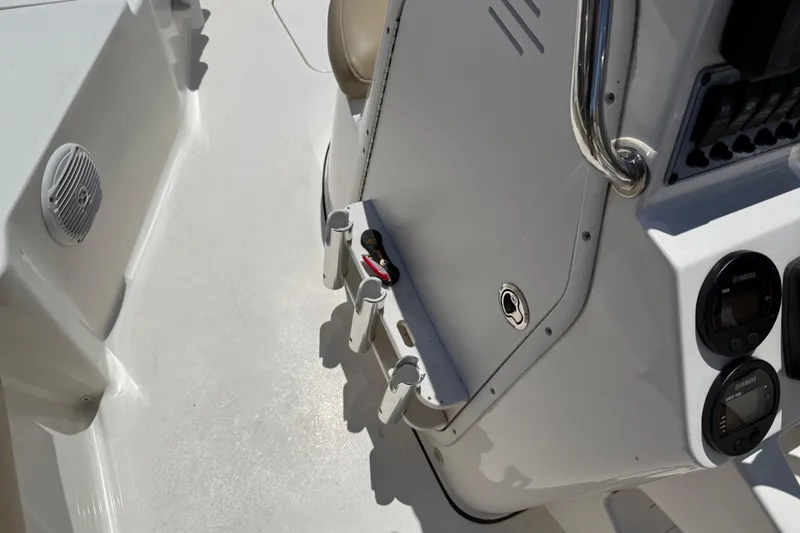 Slide: The Image of 2019 Key West 230 Bay Reef boat console with gauges and rod holders. - 13
