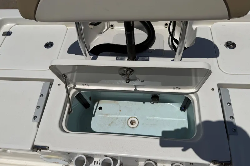 Slide: The Image of Open storage compartment on a 2019 Key West 230 Bay Reef boat. - 24